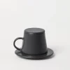 Ceramic cup with saucer and lid