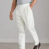 Cotton and virgin wool gabardine tailor fit trousers with reversed double pleats and waist tabs