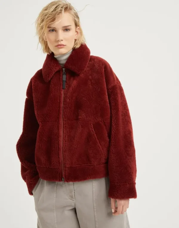 Curly shearling outerwear jacket with shiny zipper pull