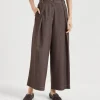 Denim-effect twill pleated A-line trousers with shiny loop