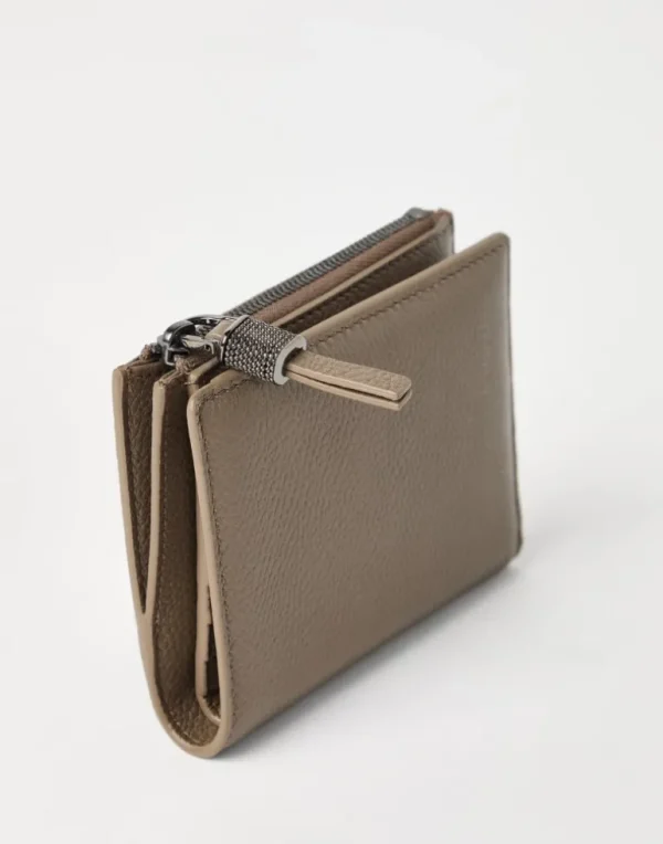 Grained leather compact wallet with shiny zipper pull