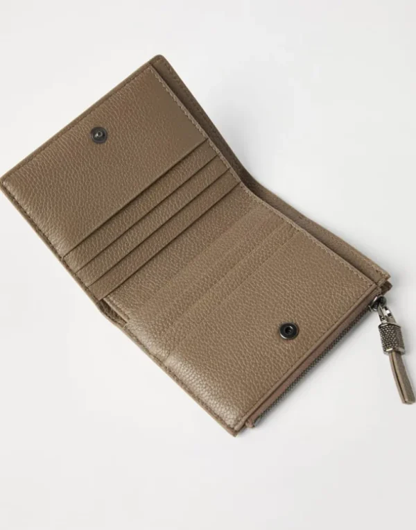 Grained leather compact wallet with shiny zipper pull