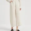 Linen baggy cropped trousers with shiny cuffs