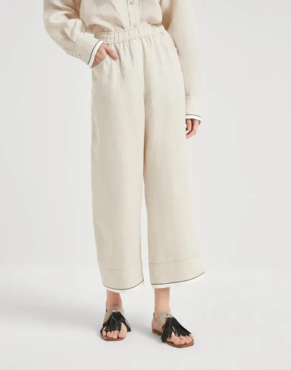 Linen baggy cropped trousers with shiny cuffs