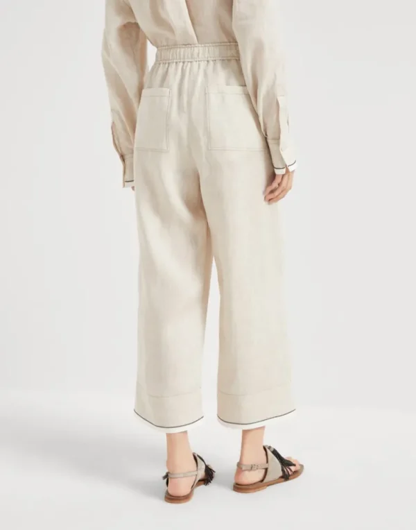 Linen baggy cropped trousers with shiny cuffs