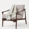 Linen throw with sparkling stripes and fringe