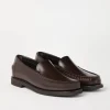 Minimal calfskin penny loafers with shiny detail