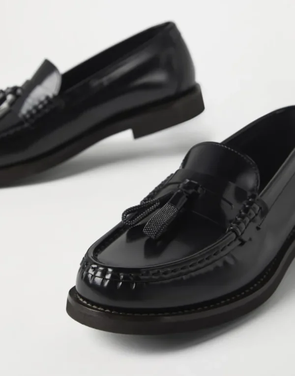 Minimal calfskin penny loafers with shiny tassels